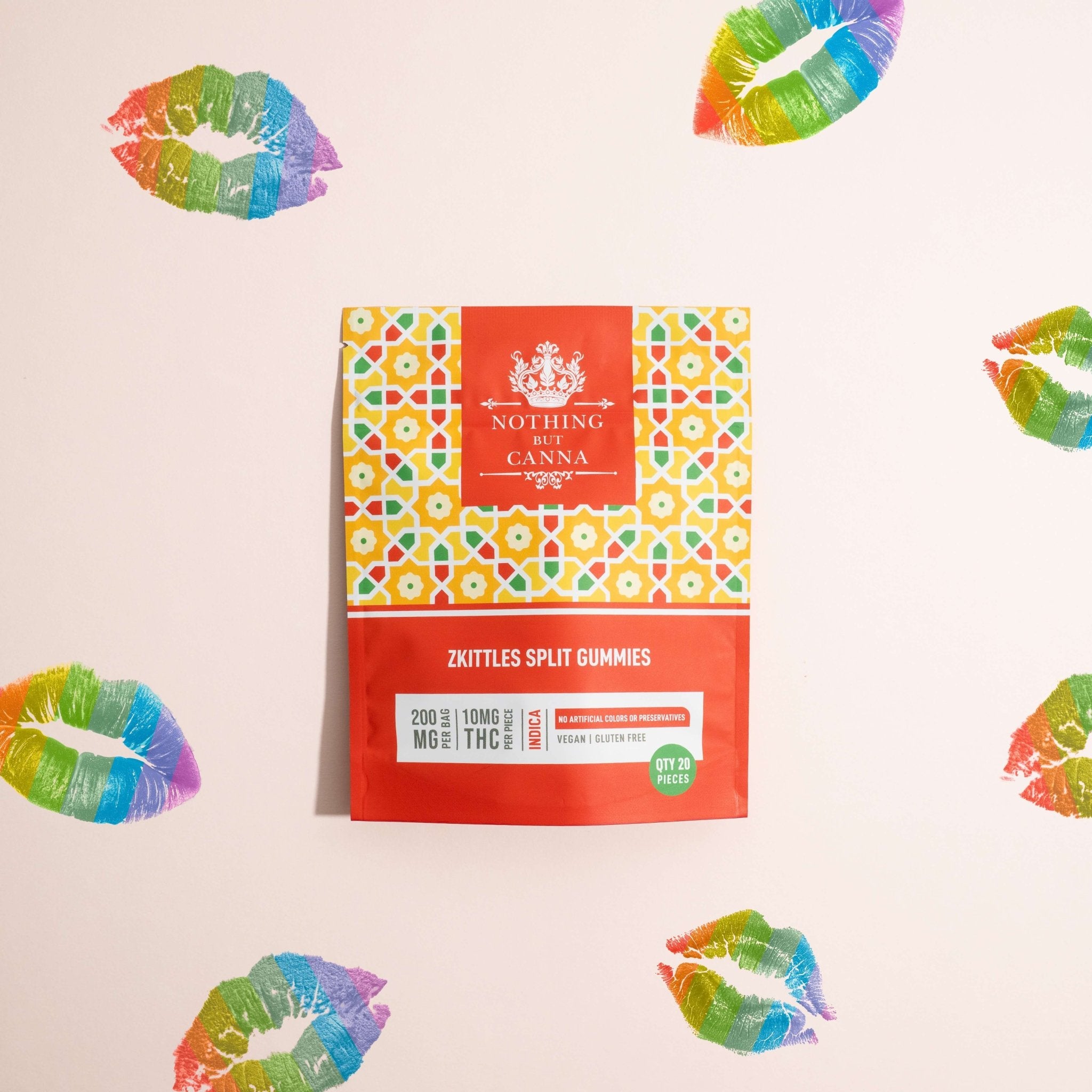 Nothing But Hemp Zkittles hemp-derived THC indica gummies package photographed on a pale gray pink background surrounded by rainbow lip print marks in a stylized lifestyle composition